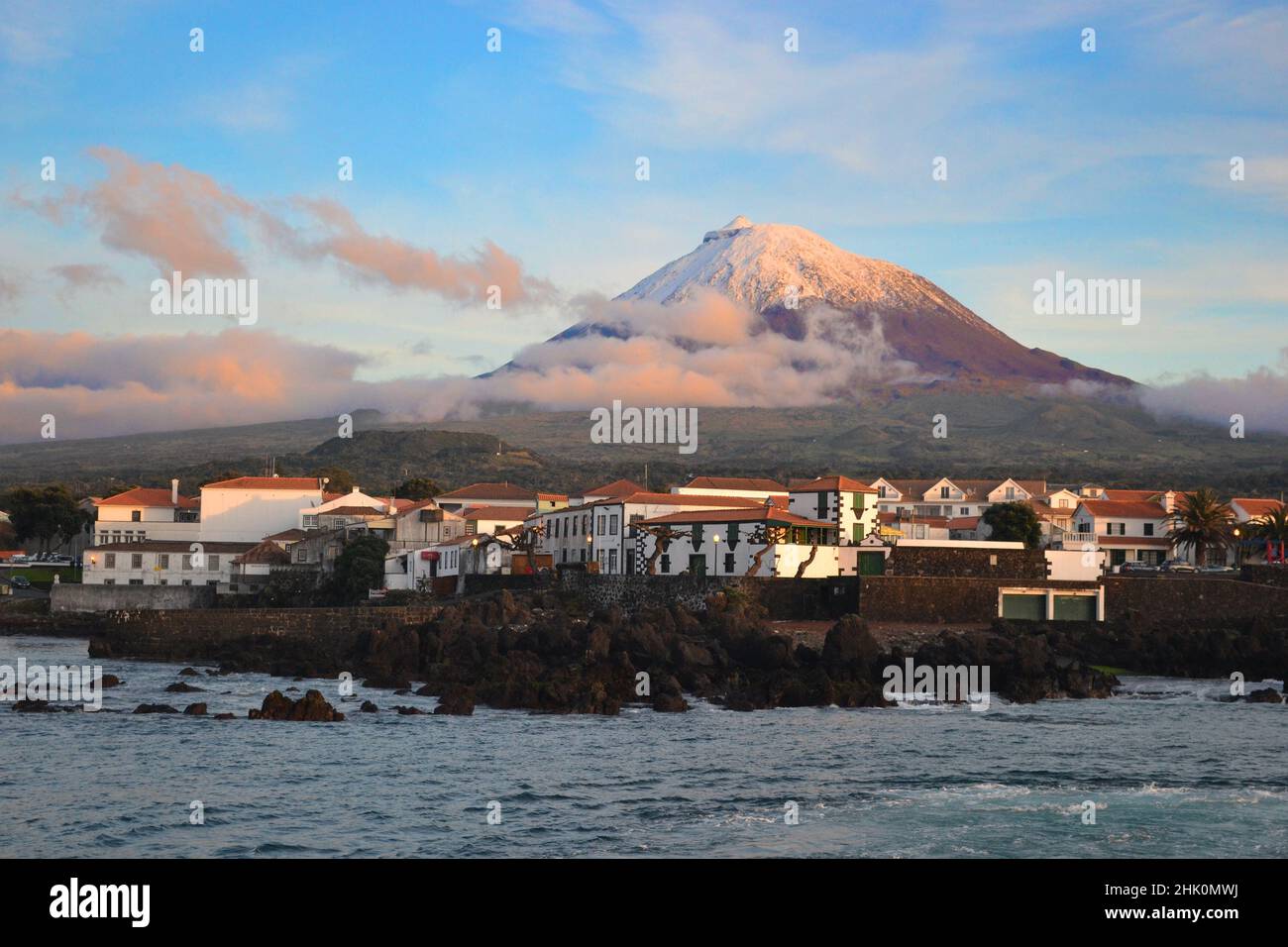 The highest mountain of Portugal, the Azores volcano Montanha do Pico on the island of Pico at sunset, village Madalena Stock Photo