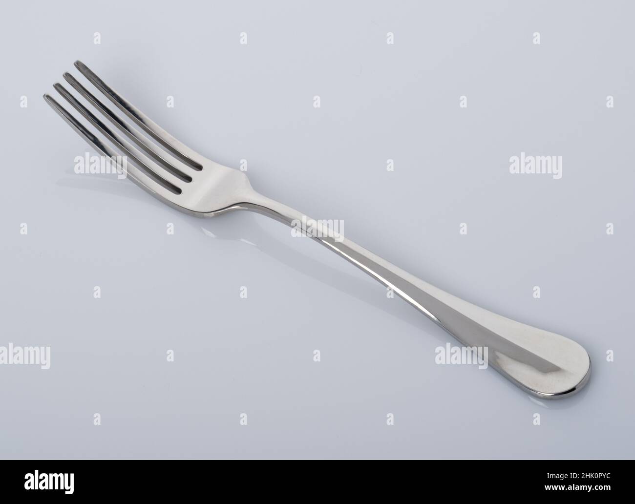 A table fork. A silver plated metal fork. Stock Photo