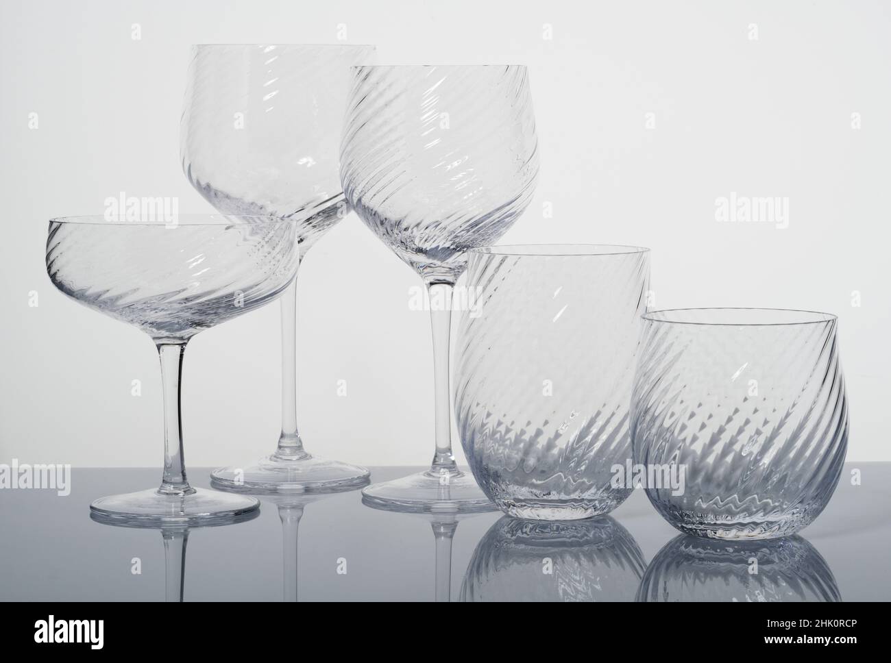 A set of glassware. Drinking vessels or drinkware. Domestic glasses for drinking liquids from. Stock Photo
