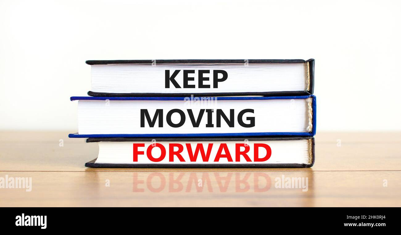 Keep moving forward symbol. Concept words Keep moving forward on books ...