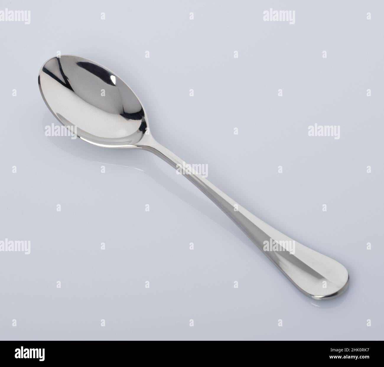 A silver spoon. 'Born with a silver spoon in their mouth'. Stock Photo