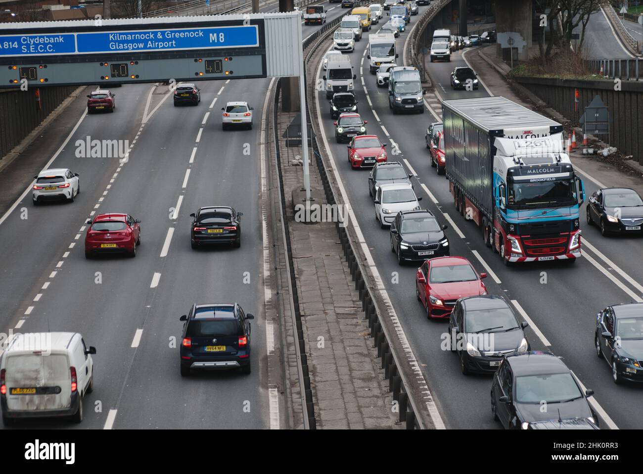 Heavy traffic during rush hour heading northbound on the M8 motorway through the city of Glasgow, Scotland. Stock Photo