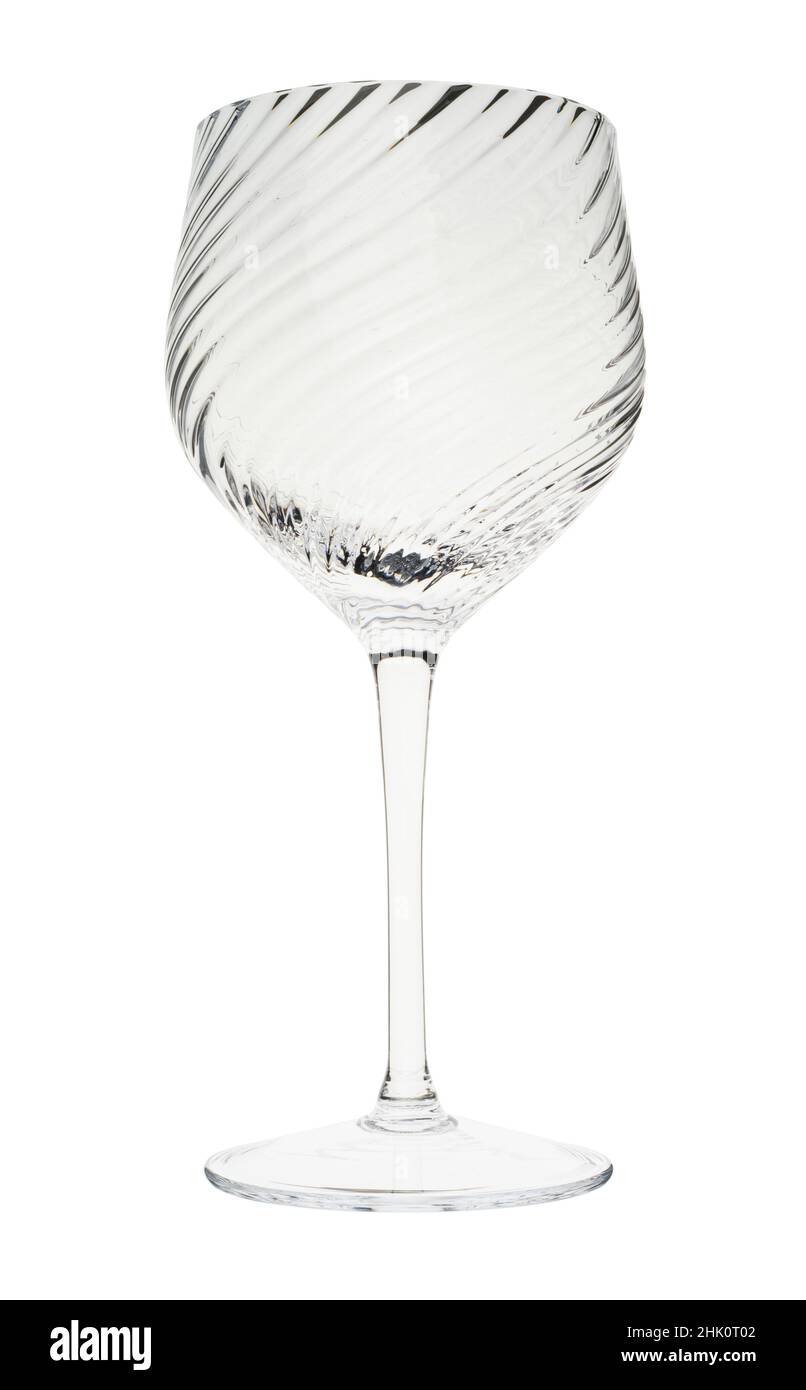 A wine glass. Glassware. Drinking vessels or drinkware. Domestic glasses for drinking liquids from. Stock Photo