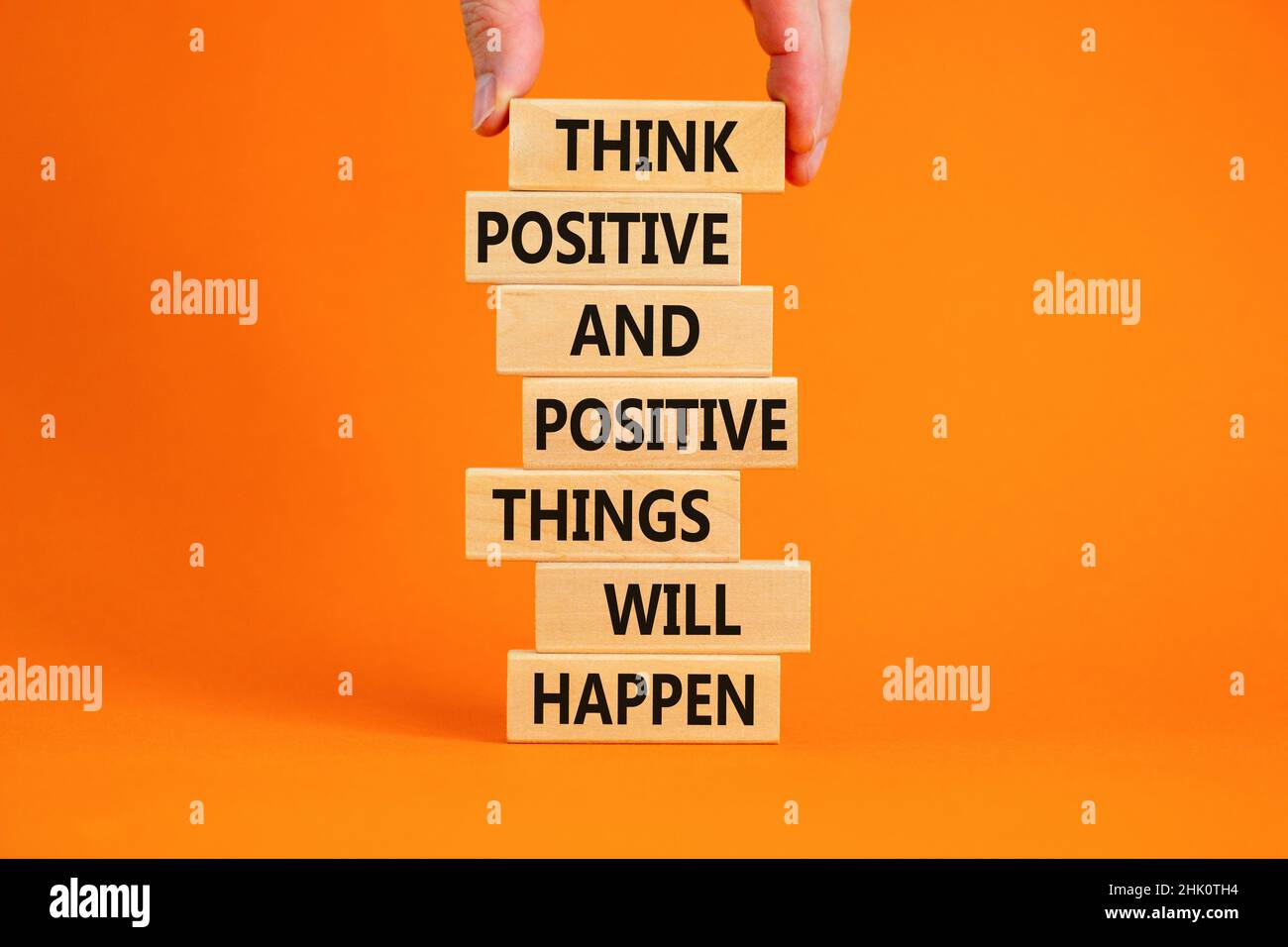 Think positive symbol. Wooden blocks with words Think positive and ...