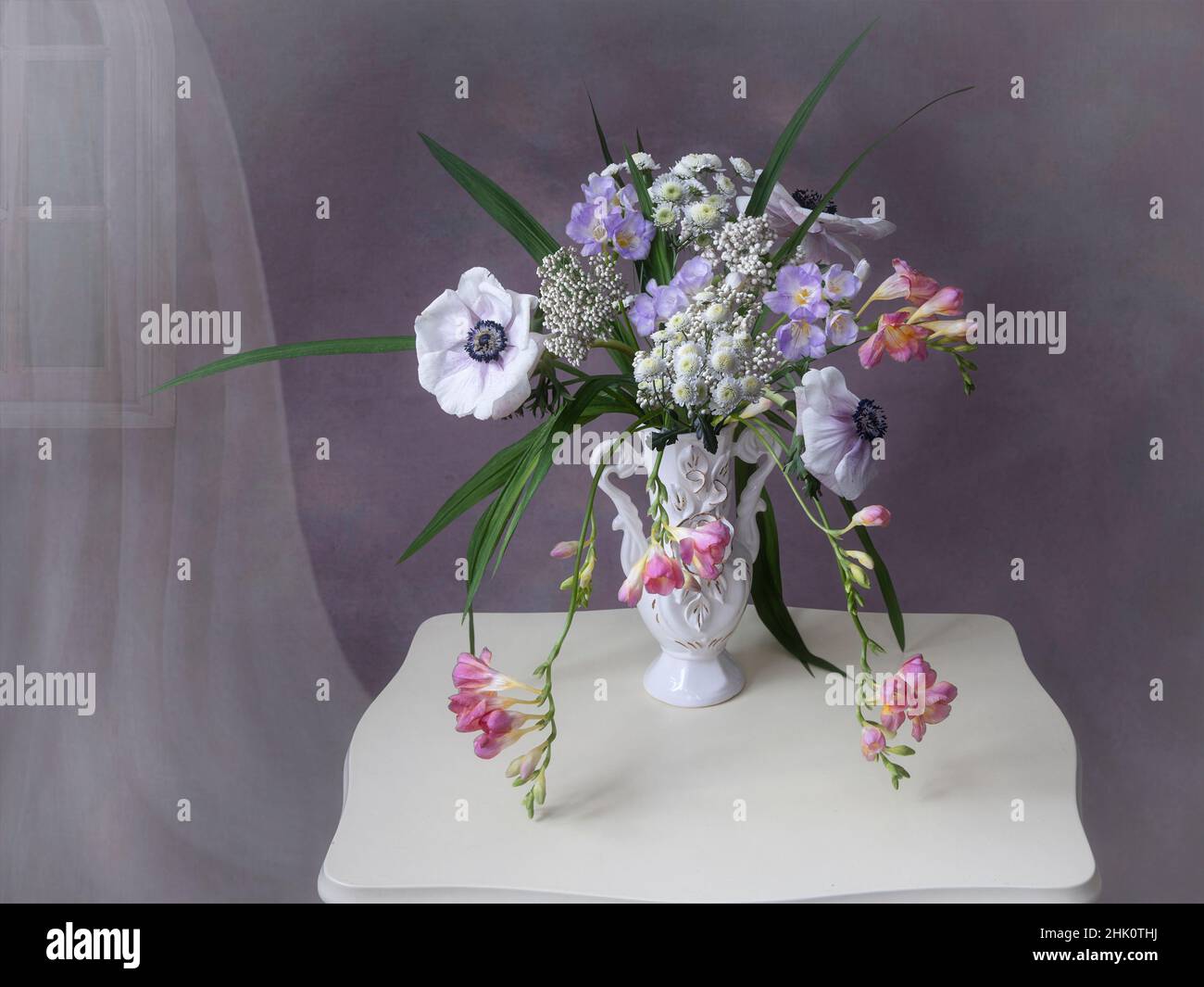 Still life with bouquet of anemones and freesia Stock Photo