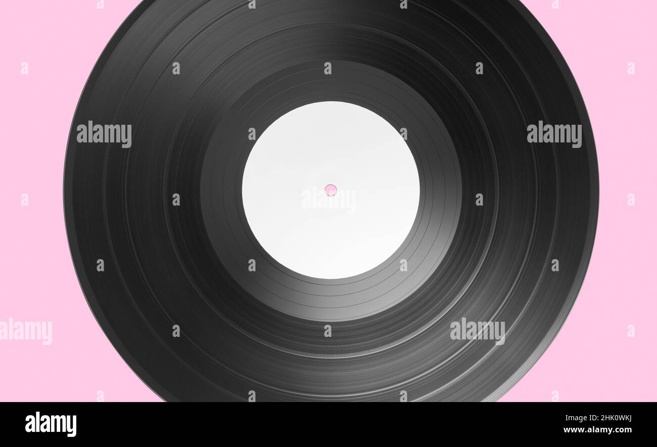 Vinyl record on pink background. White label Mock up Stock Photo
