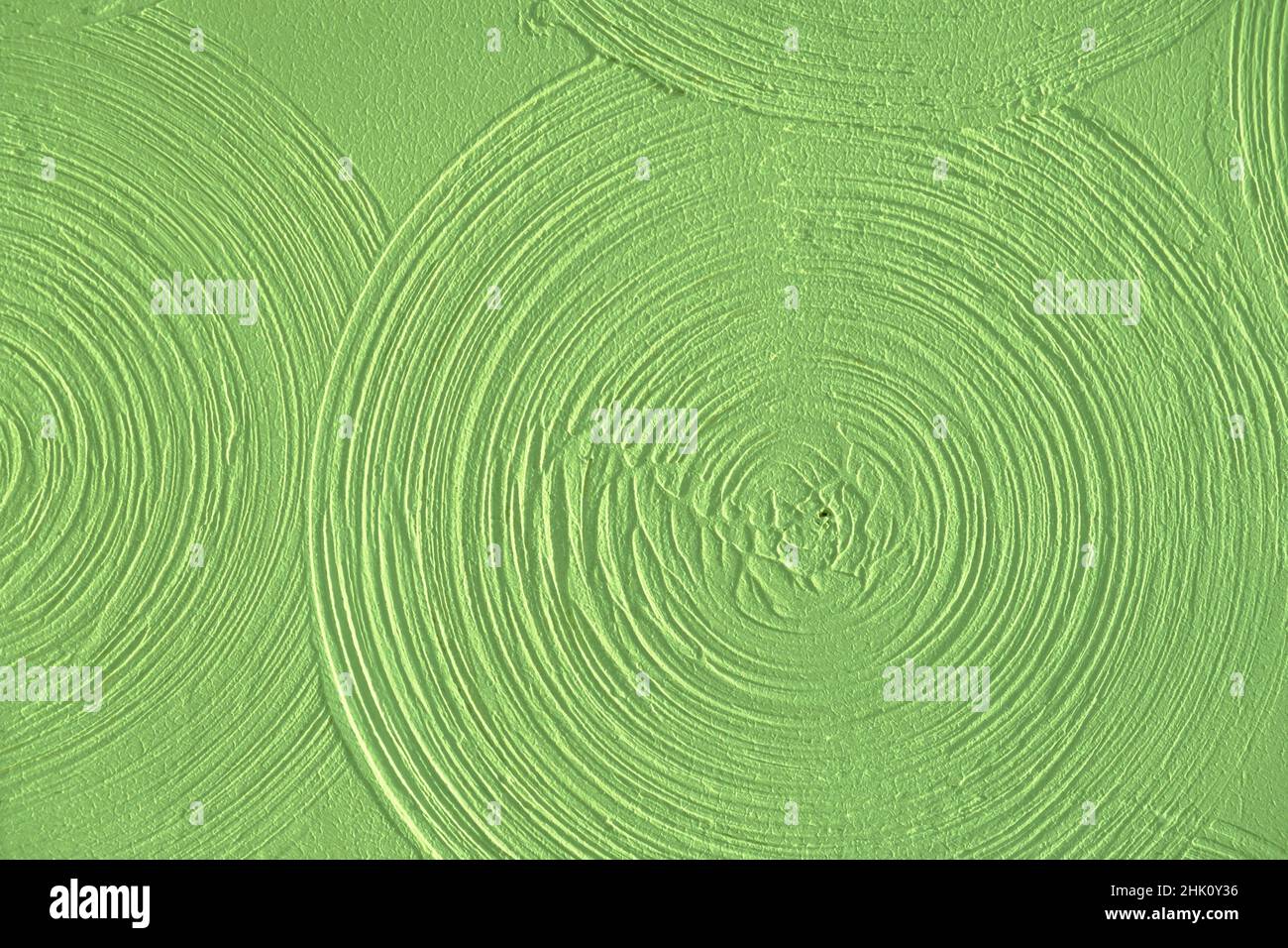 Close-up light green abstract background gypsum panel, spiral-shaped volumetric, green circles, futuristic background, selective focus Stock Photo