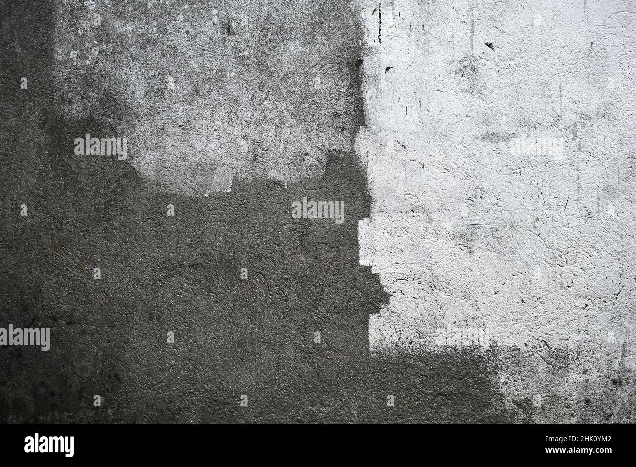 Concrete wall with lime wash white strokes, grunge background or