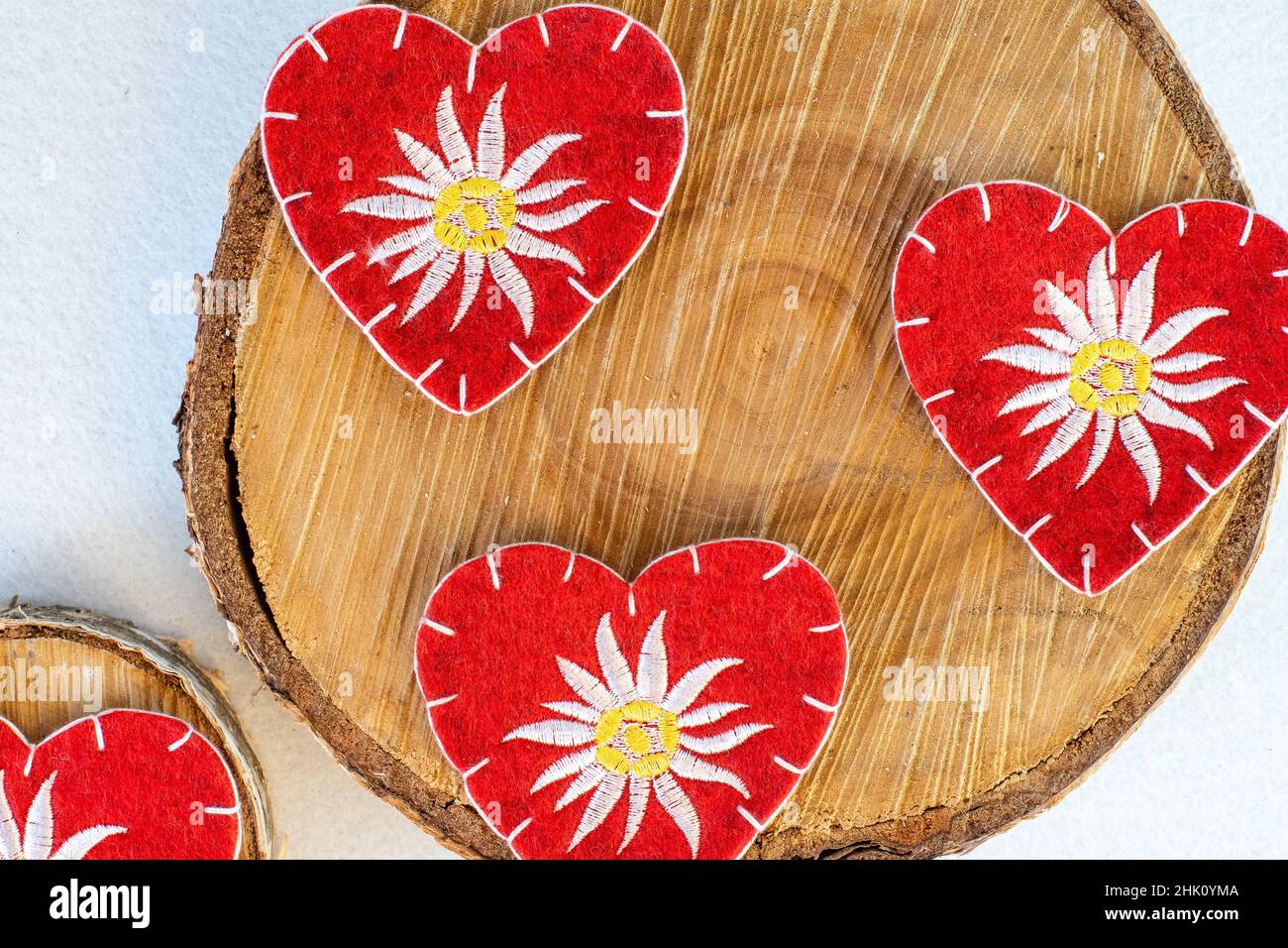 red hearts embroidered with edelweiss Stock Photo