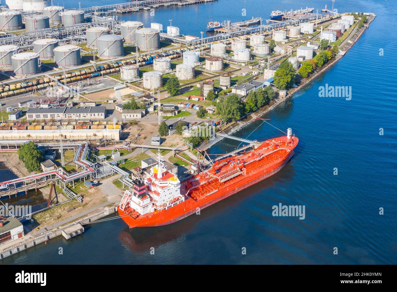 Aerial view large port oil loading terminal with large storage tanks. Railway infrastructure for the delivery of bulk cargo by sea, using pump station Stock Photo