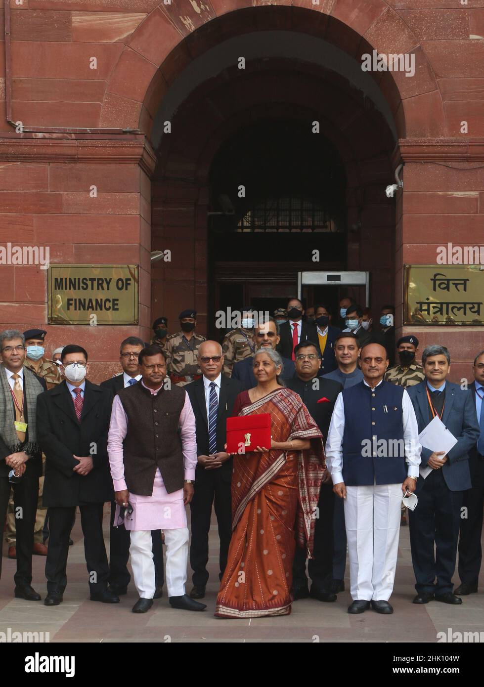 NEW DELHI, INDIA - FEBRUARY 1: Union Minister of Finance Nirmala Sitharaman is seen holding the tab instead of traditional ‘bahi khata' along with MoS Finance Pankaj Chaudhary, Bhagwat Karad and other senior officials before leaving from Ministry of Finance to the Parliament to present Union Budget 2022-23 on February 1, 2022 in New Delhi, India. Nirmala Sitharaman, who presented Union Budget 2022 in Parliament on Tuesday, said that it will lay the foundation for economic growth through public investment as Asia's third-largest economy emerges from a pandemic-induced slump. (Photo by Salman Al Stock Photo