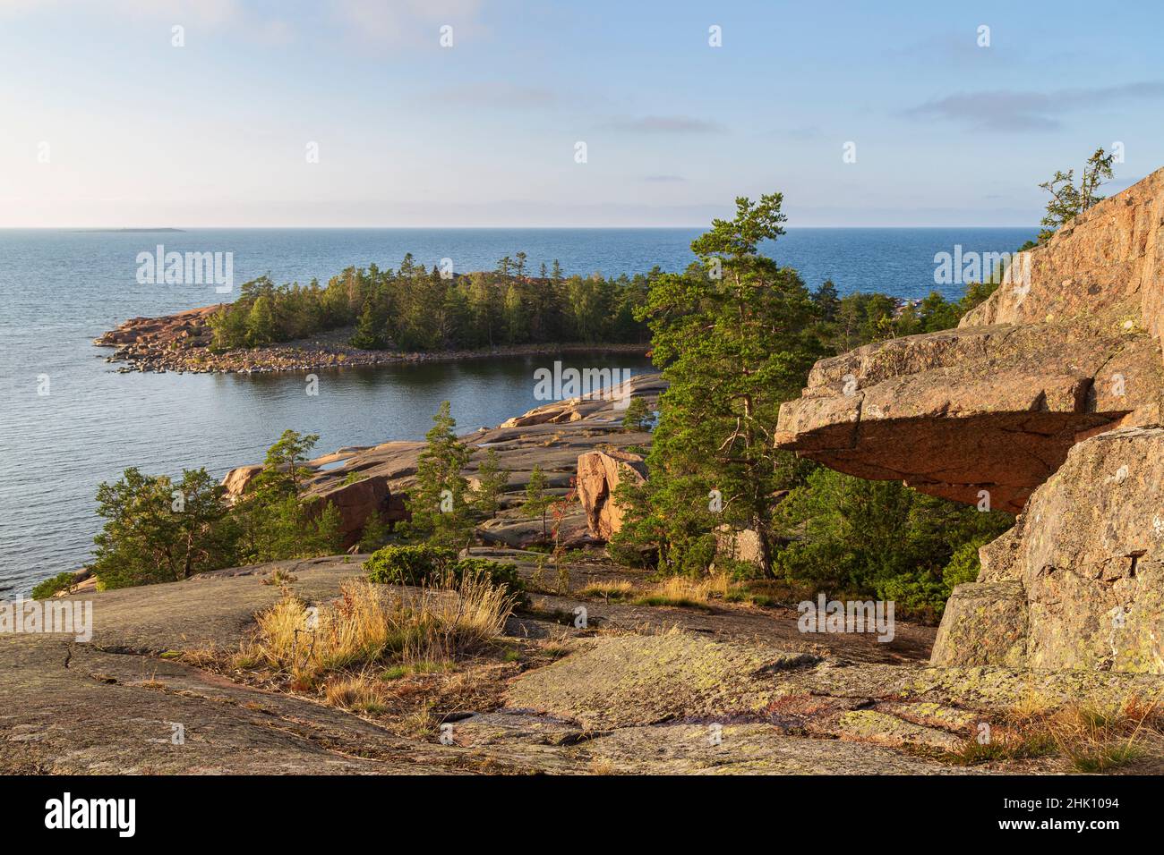 Rocky and forested cliff by the sea at Geta in Åland Islands, Finland, on a sunny day in the summer, viewed from above. Stock Photo