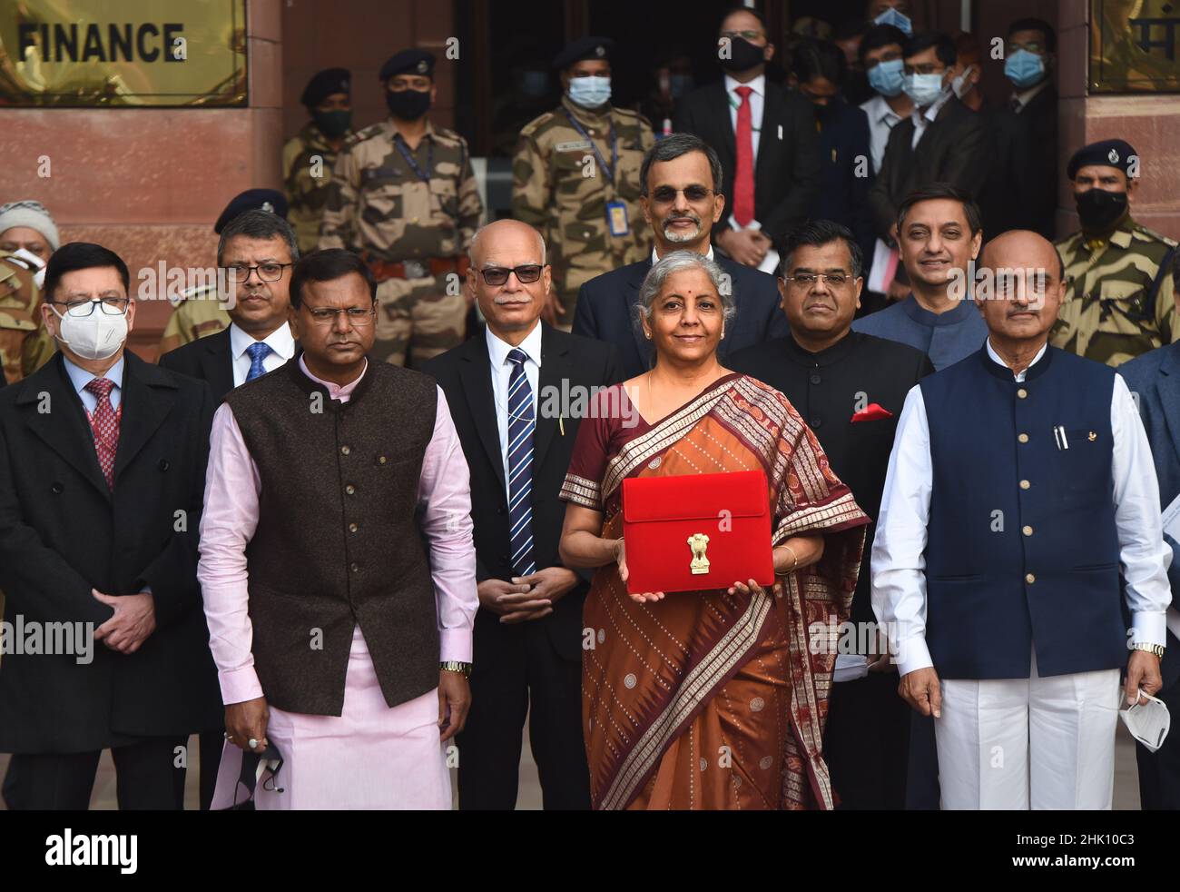NEW DELHI, INDIA - FEBRUARY 1: Union Minister of Finance Nirmala Sitharaman is seen holding the tab instead of traditional ‘bahi khata' along with MoS Finance Pankaj Chaudhary, Bhagwat Karad and other senior officials before leaving from Ministry of Finance to the Parliament to present Union Budget 2022-23 on February 1, 2022 in New Delhi, India. Nirmala Sitharaman, who presented Union Budget 2022 in Parliament on Tuesday, said that it will lay the foundation for economic growth through public investment as Asia's third-largest economy emerges from a pandemic-induced slump. (Photo by Ajay Agga Stock Photo