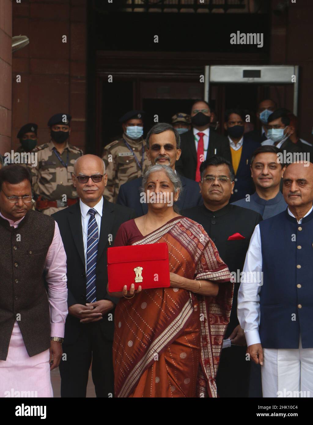NEW DELHI, INDIA - FEBRUARY 1: Union Minister of Finance Nirmala Sitharaman is seen holding the tab instead of traditional ‘bahi khata' along with MoS Finance Pankaj Chaudhary, Bhagwat Karad and other senior officials before leaving from Ministry of Finance to the Parliament to present Union Budget 2022-23 on February 1, 2022 in New Delhi, India. Nirmala Sitharaman, who presented Union Budget 2022 in Parliament on Tuesday, said that it will lay the foundation for economic growth through public investment as Asia's third-largest economy emerges from a pandemic-induced slump. (Photo by Salman Al Stock Photo
