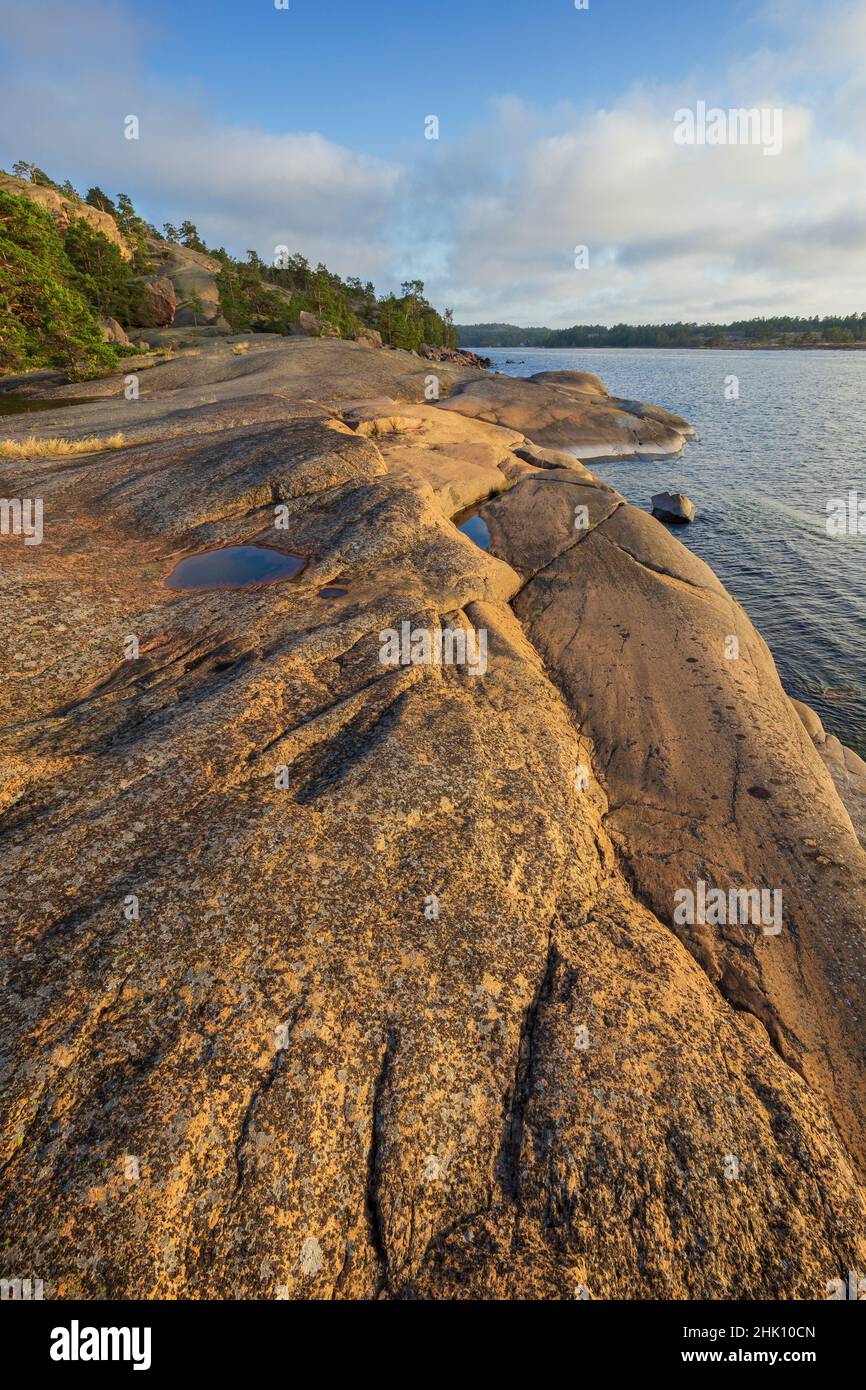 Rocky cliff by the sea at Geta in Åland Islands, Finland, on a sunny day in the summer. Stock Photo