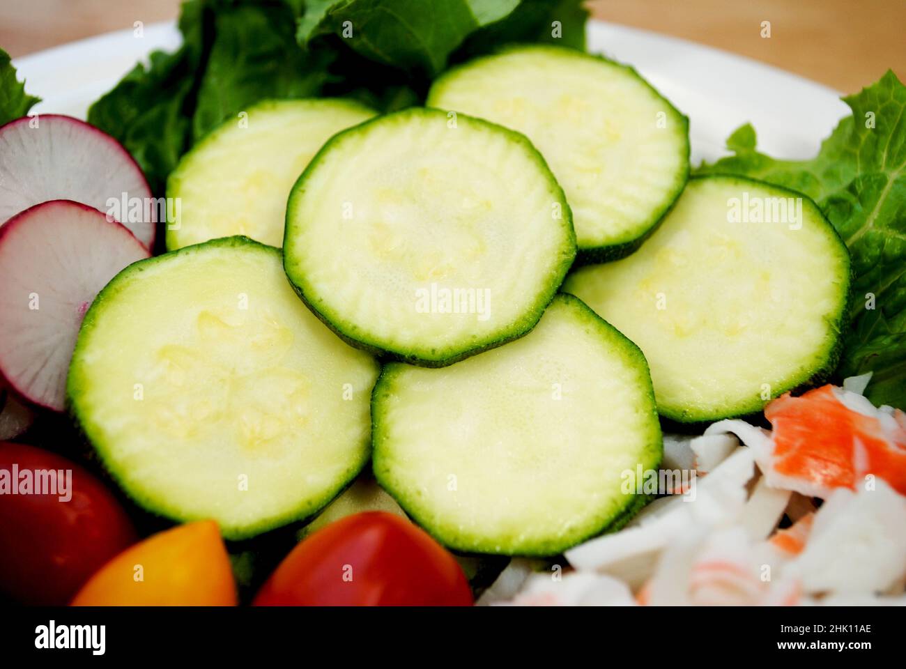 Close-up of Raw Zucchini as Part of a Raw Fresh Salad Stock Photo