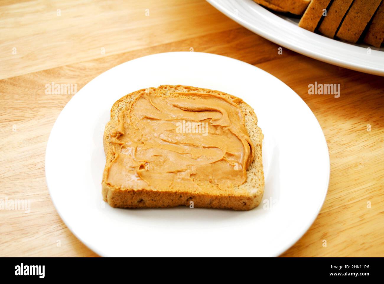 Peanut Butter Spread on Wheat Bread Stock Photo Alamy