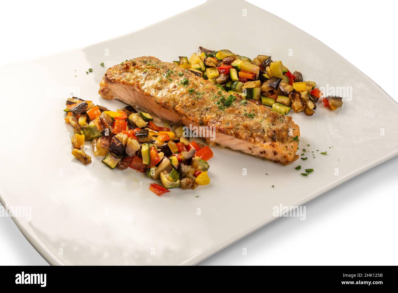 Crispy salmon fillet baked with herbs with side dish ratatouille on