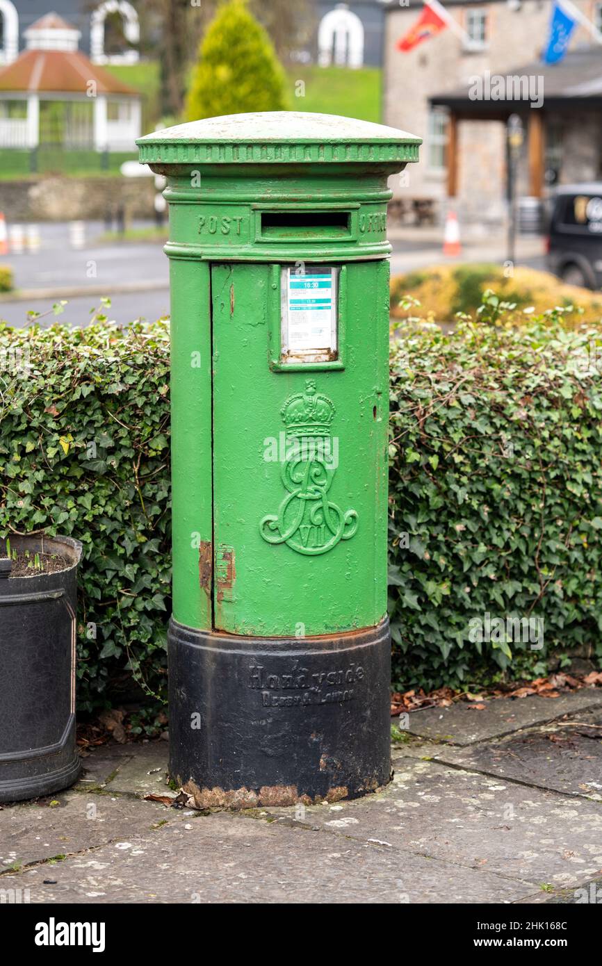 Traditional green letterbox, standing in the street Stock Photo Alamy