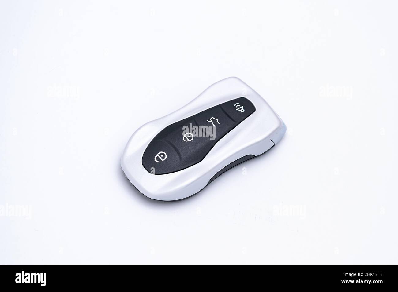 Smart car key on a white background. Electronics, spare parts and car accessories. Horizontal photo. Stock Photo