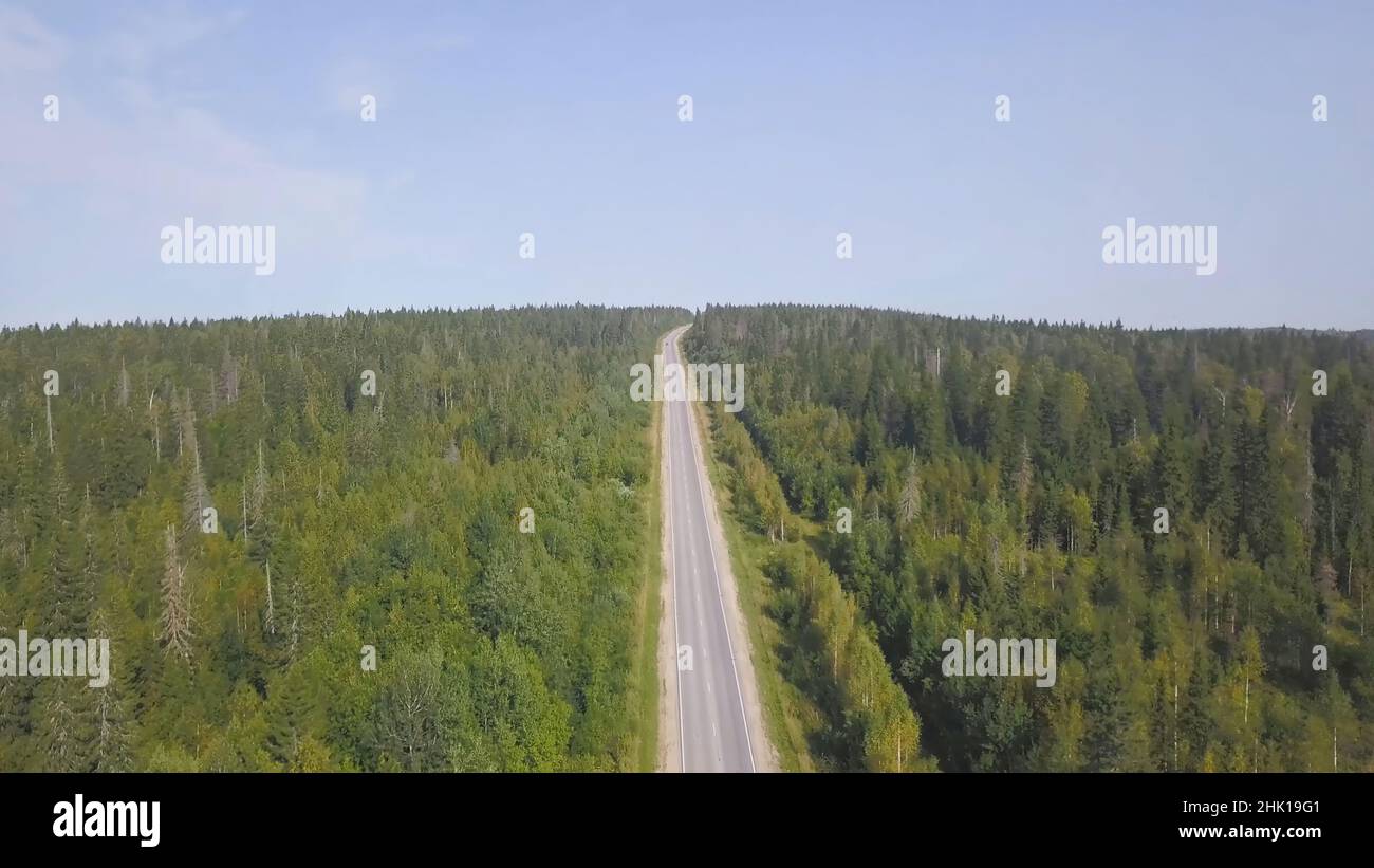 Top view scenic winding country road through green farmland. Clip. Aerial  rural road countryside Stock Photo - Alamy