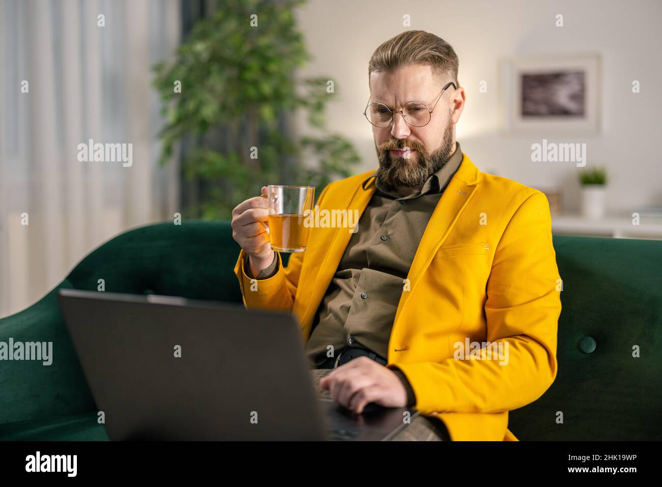 Man using laptop at home Stock Photo