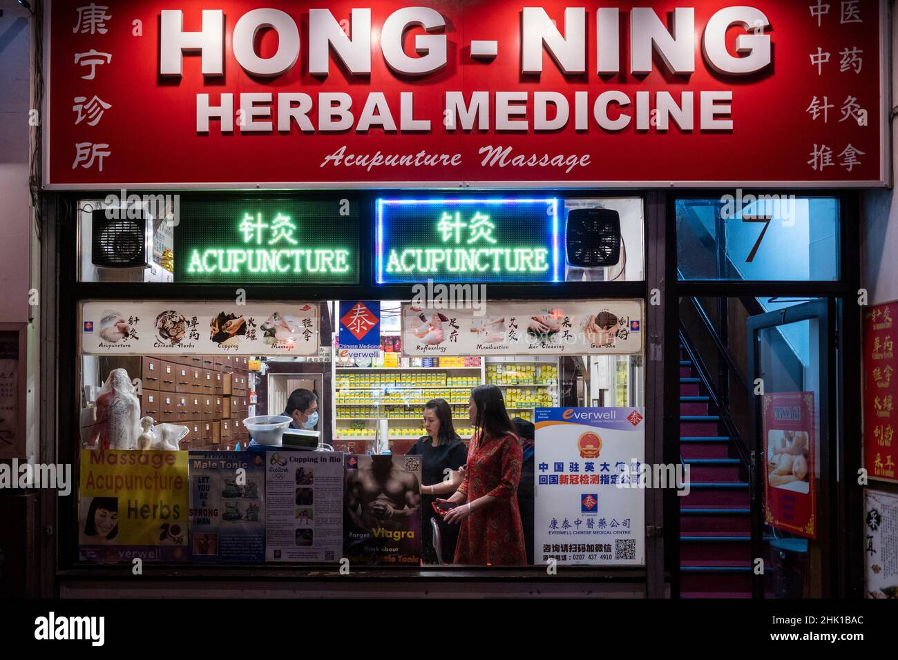 London, UK.  1 February 2022. A herbal medicine store in Chinatown on the evening of Chinese New Year as The Year of the Tiger officially begins.  Festivities in Chinatown are scaled back this year due to the pandemic but restaurants will be hoping that business picks up now that Plan B Omicron restrictions have been relaxed by the UK government.  Credit: Stephen Chung / Alamy Live News Stock Photo