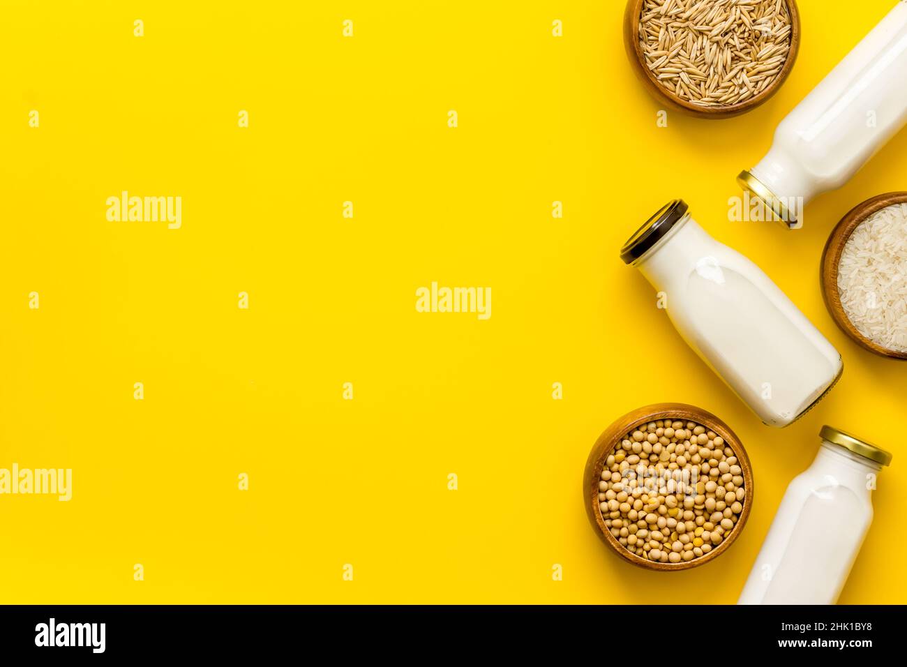 Dairy free substitute milk with nuts and cereals, top view Stock Photo