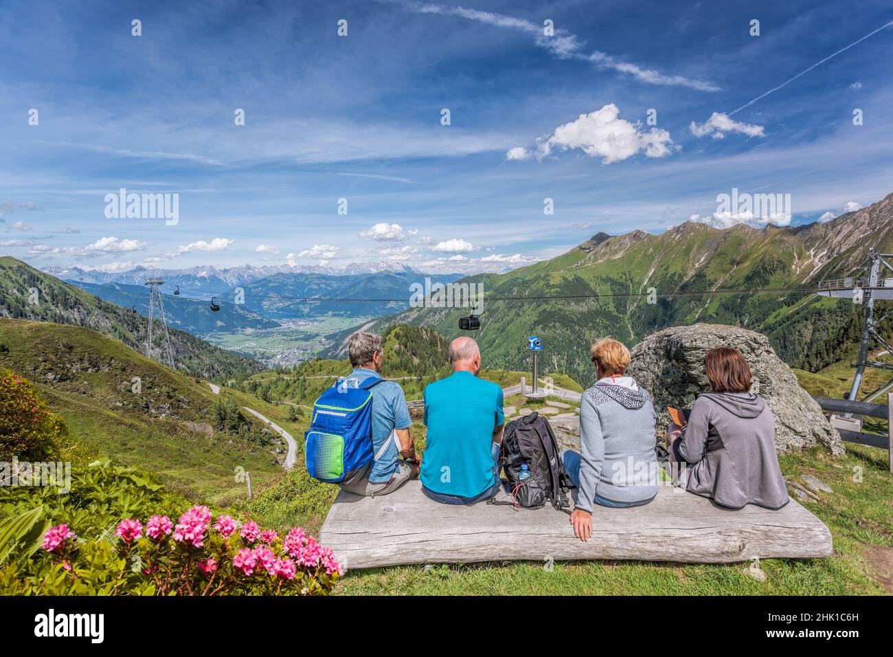 Tourists are watching the lake among Austrian Alps and cable cars in Zell am See-Kaprun region, Austria Stock Photo