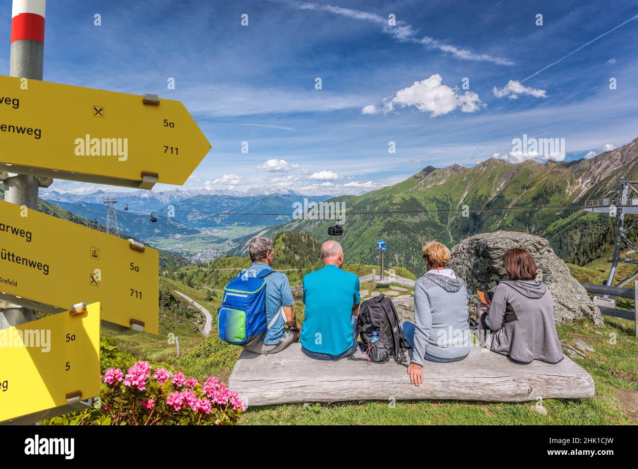 Tourists are watching the lake among Austrian Alps and cable cars in Zell am See-Kaprun region, Austria Stock Photo