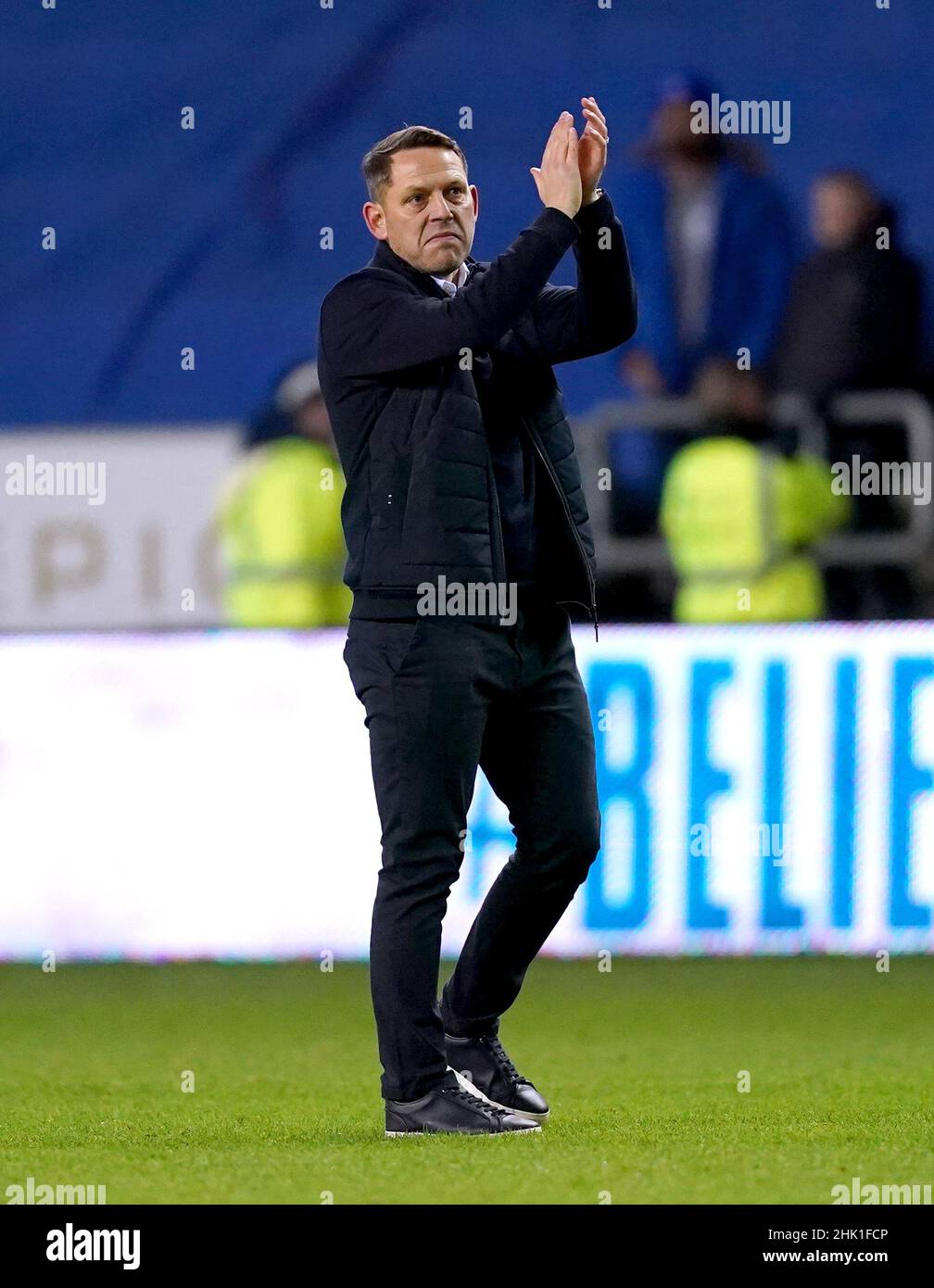 Wigan Athletic manager Leam Richardson applauds the fans at the end of the Sky Bet League One match at the DW Stadium, Wigan. Picture date: Tuesday February 1, 2022. Stock Photo
