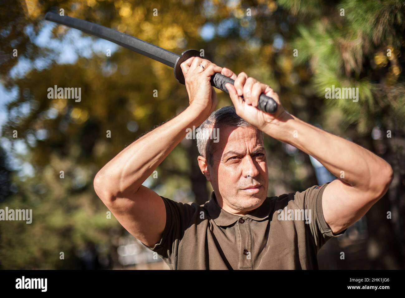 Instructor demonstrates katana sword fighting techniques and training