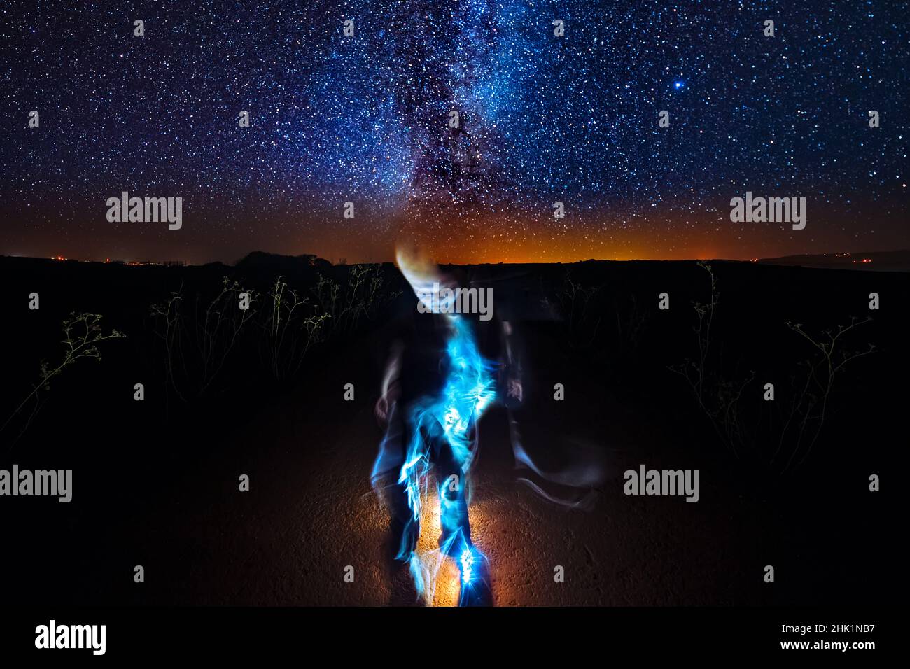 Extraterrestrial Alien Entity with starry sky in background Stock Photo