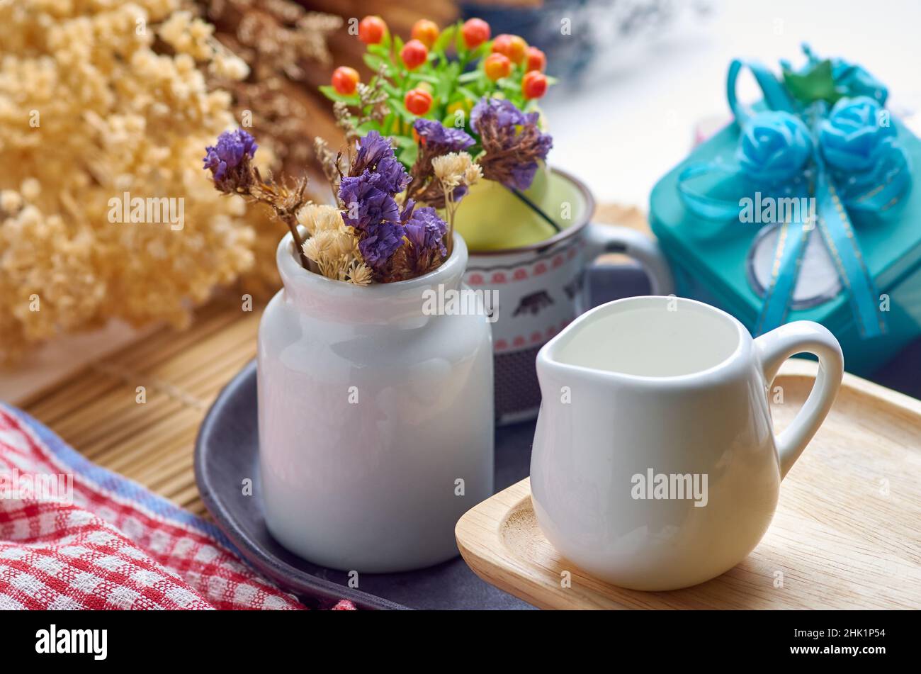 Dried flowers and white ceramic wares Stock Photo