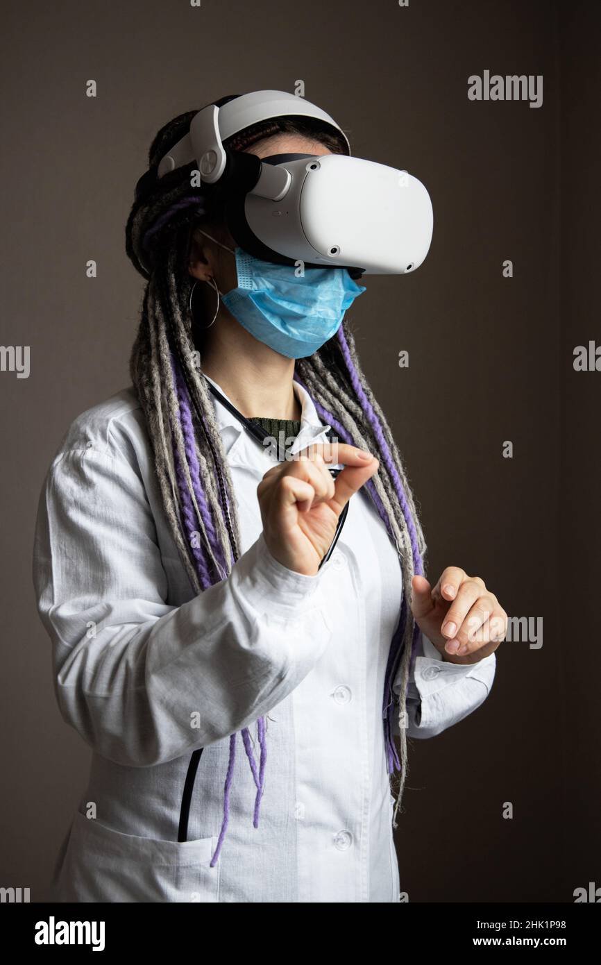 Medical worker is using virtual reality helmet Stock Photo