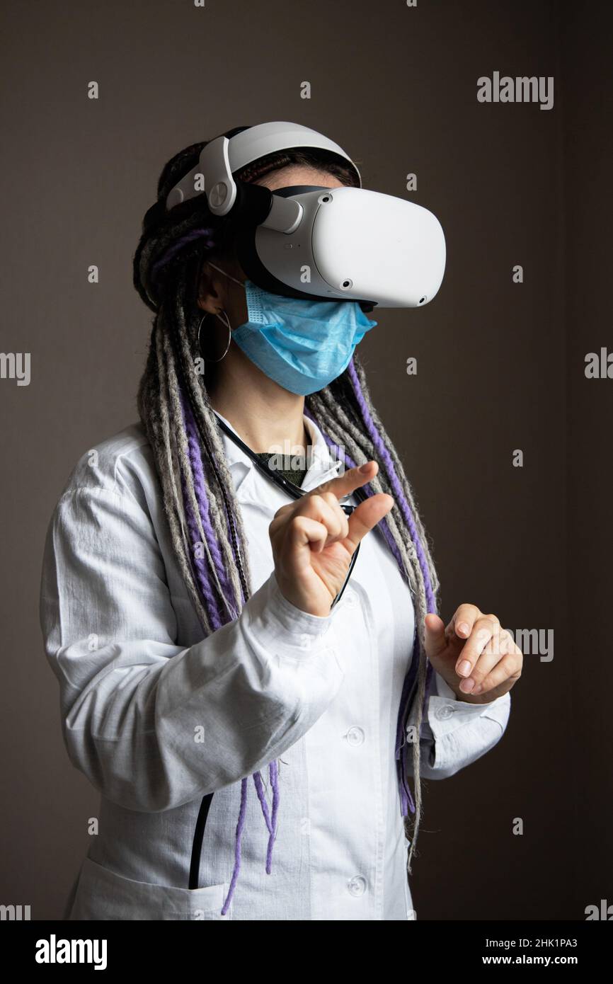 Medical worker is using virtual reality helmet Stock Photo