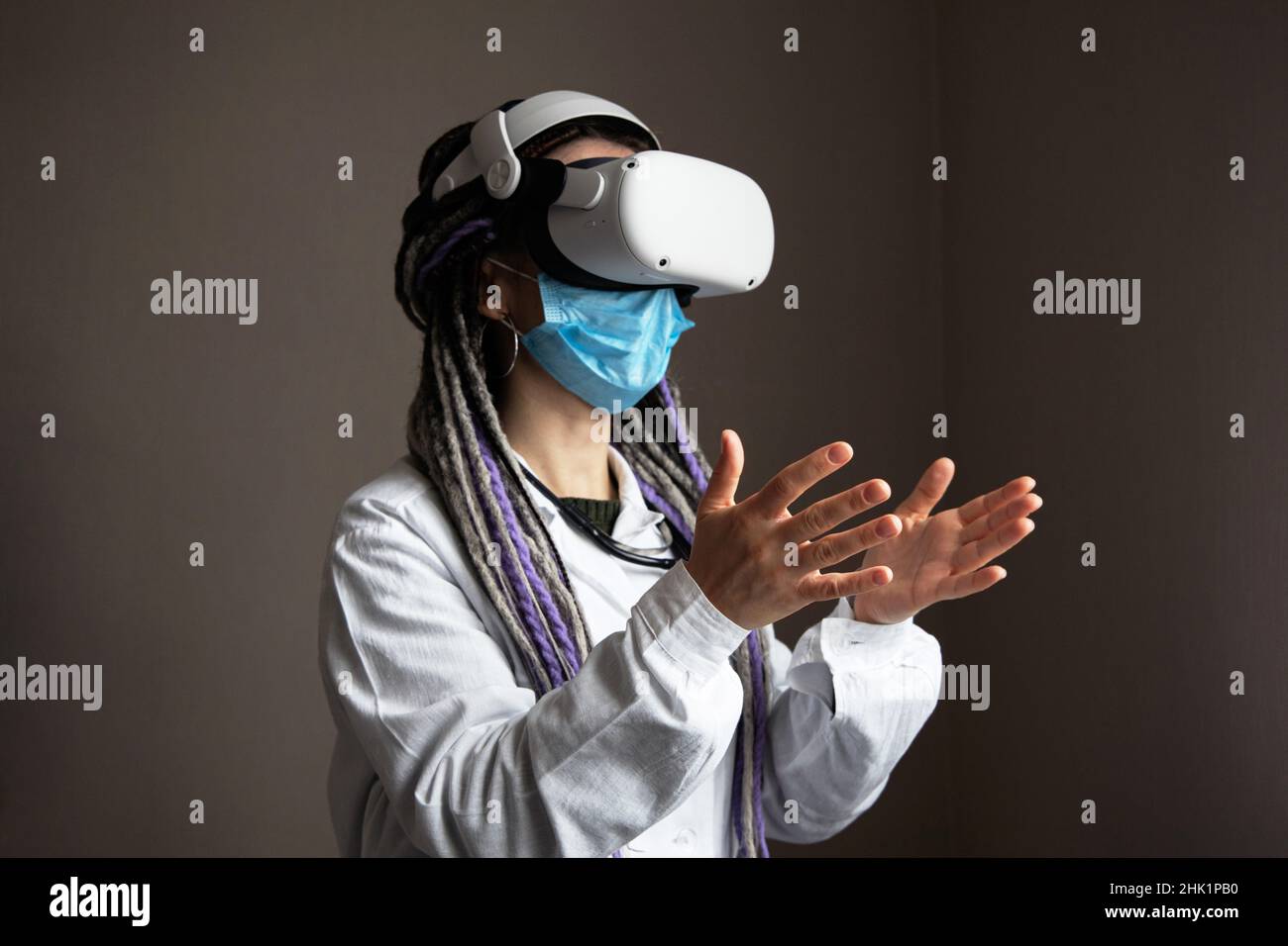 Medical worker is using virtual reality helmet Stock Photo