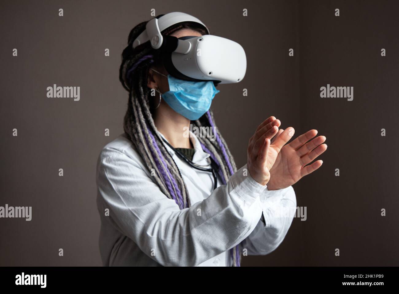 Medical worker is using virtual reality helmet Stock Photo