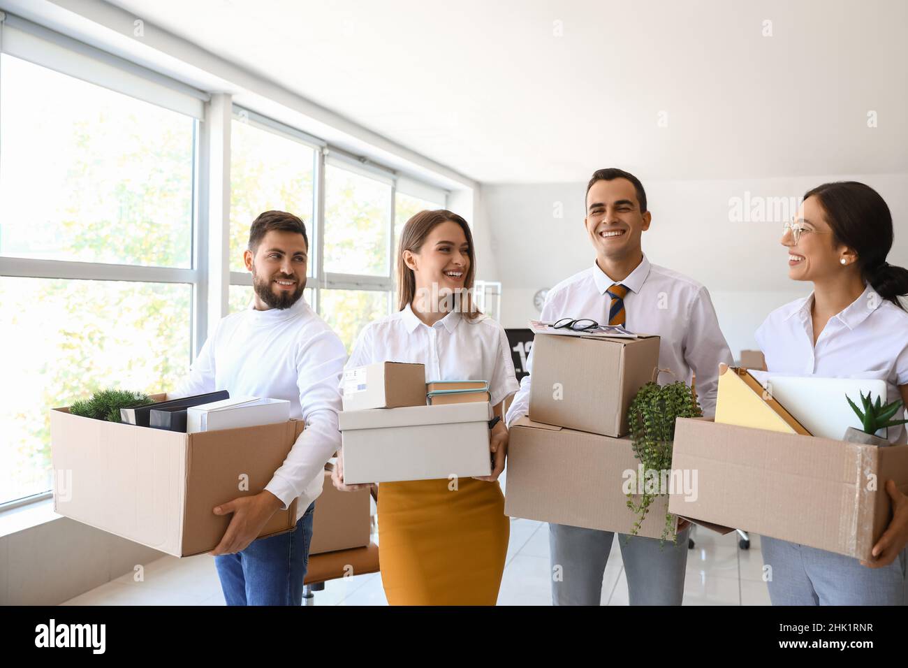People Holding Box Business people holding boxes with things in office on moving day Stock ...
