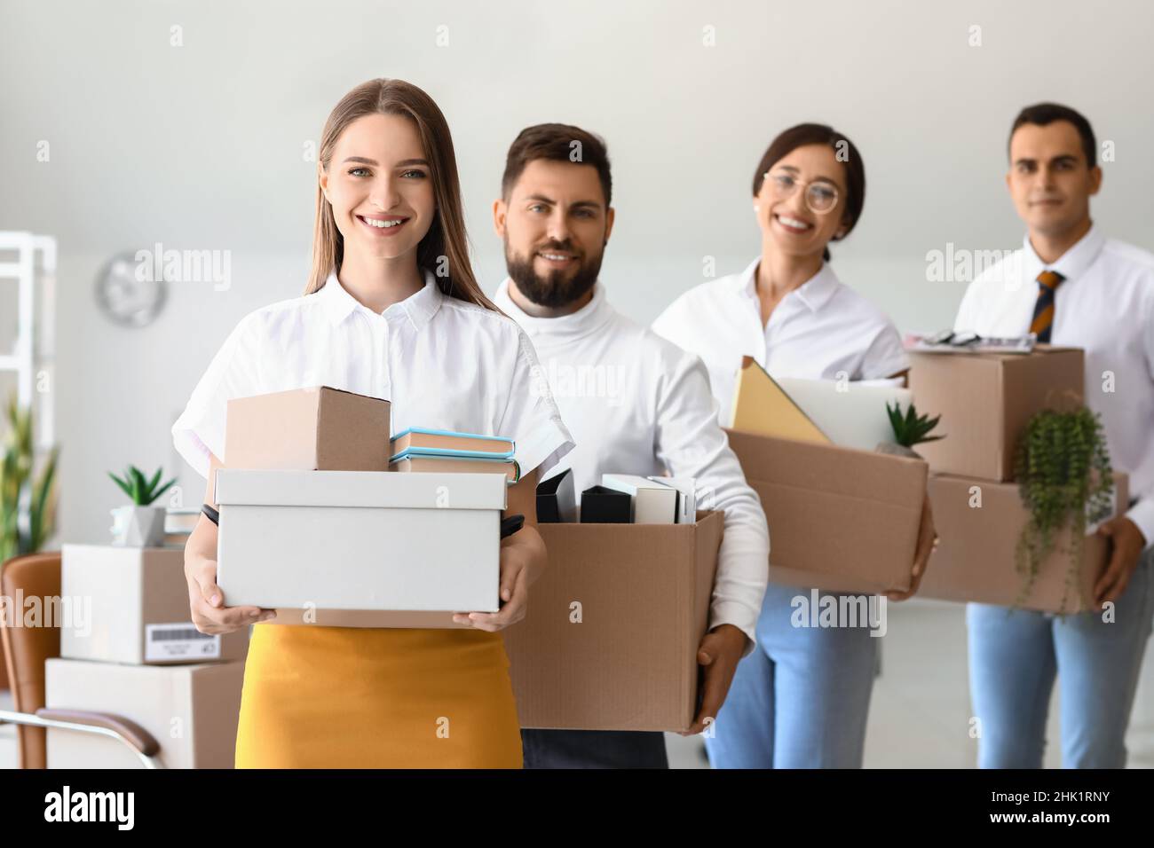 People Holding Box Business people holding boxes with things in office on moving day Stock ...