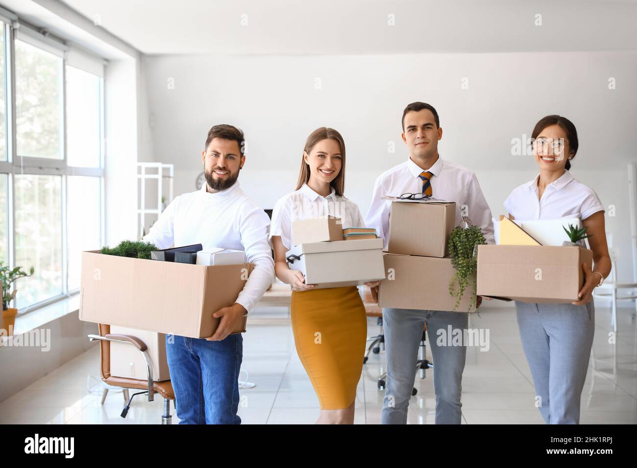 People Holding Box Business people holding boxes with things in office on moving day Stock ...