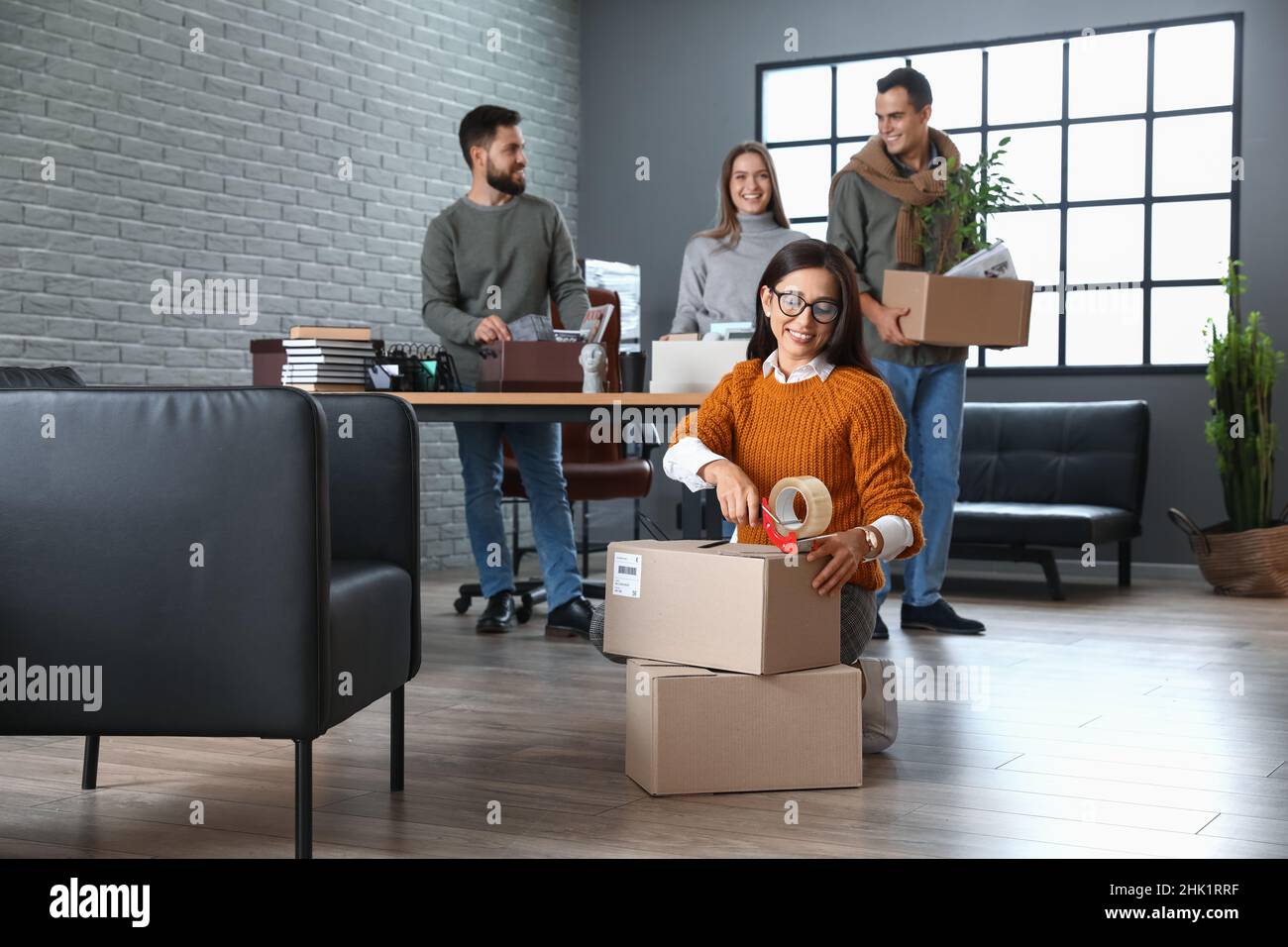 Business people packing stuff in office on moving day Stock Photo - Alamy