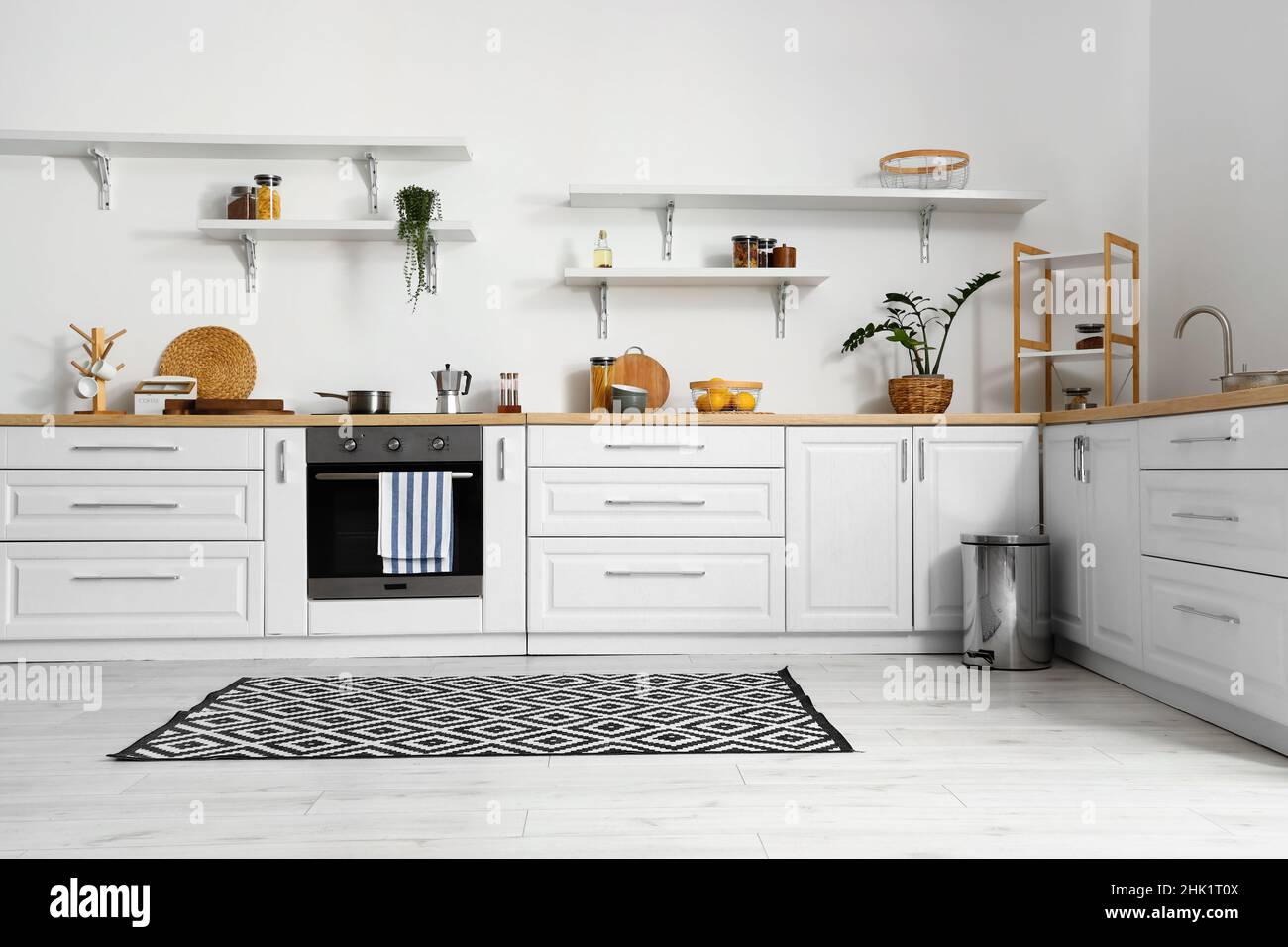 Interior of stylish kitchen with modern counters Stock Photo - Alamy