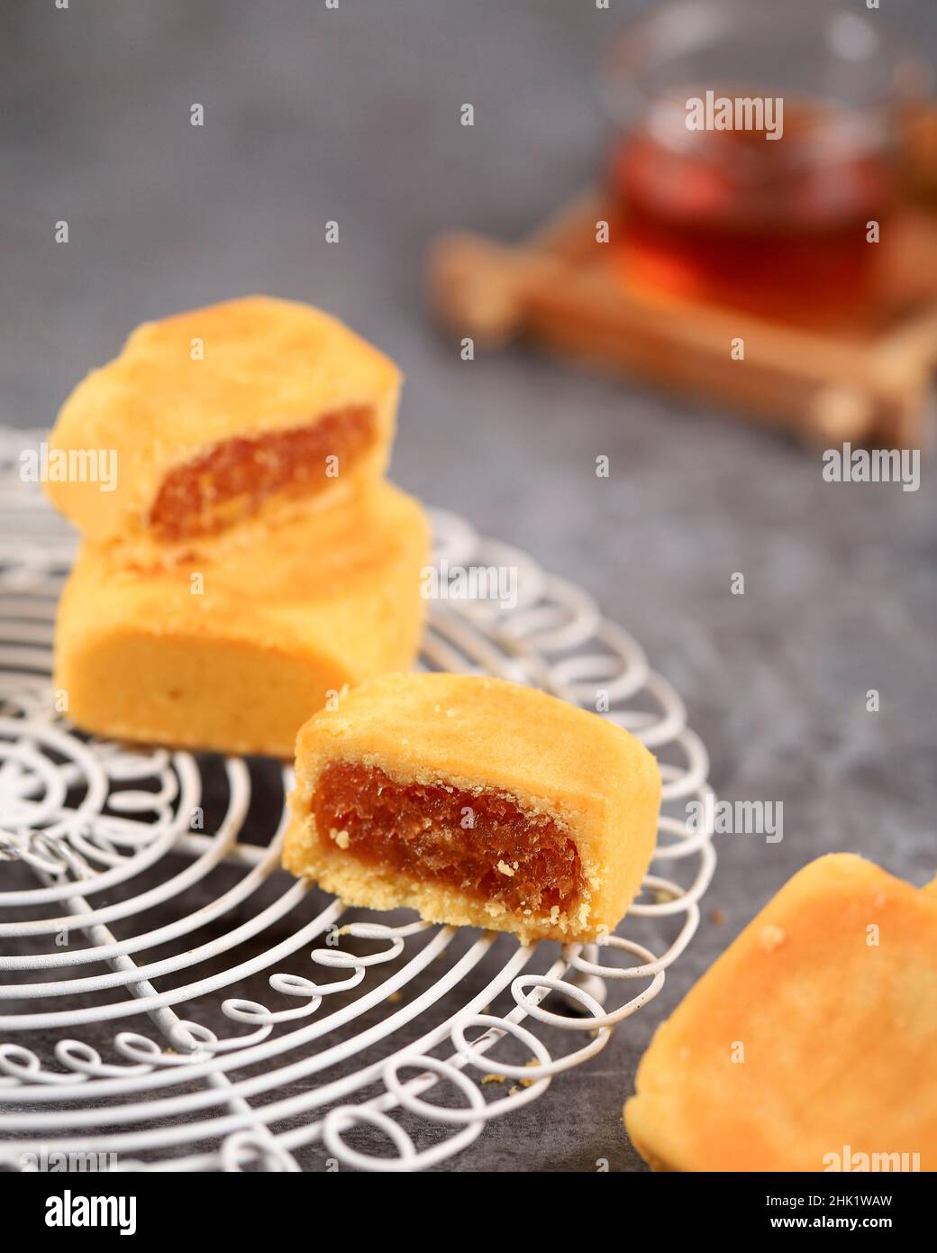 Pineapple Cake is a Sweet Traditional Taiwanese Pastry Containing Butter, Flour, Egg, Sugar, and Pineapple Jam. Served with Tea. Selected Focus Stock Photo