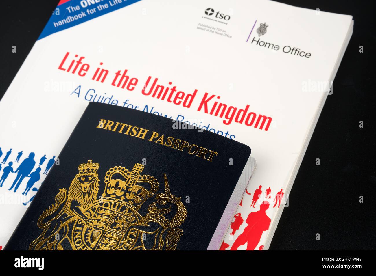 British Passport and offical test book LIFE IN THE UNITED KINGDOM which is required for Indefinite Leave to Remain and UK Citizenship. Stafford, Unite Stock Photo