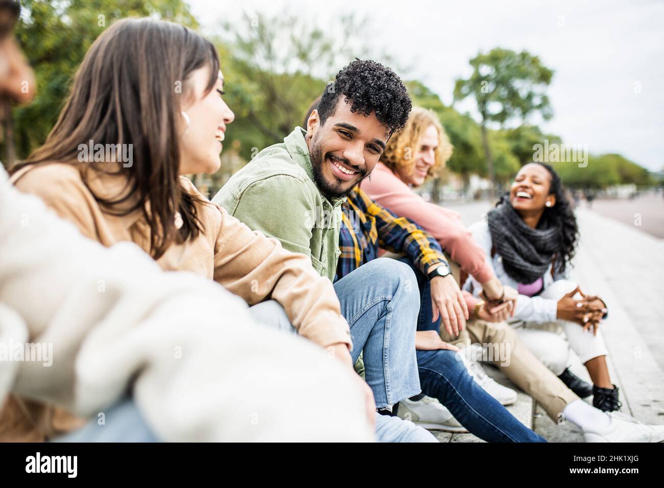Diverse group of young people laughing and having fun together Stock Photo