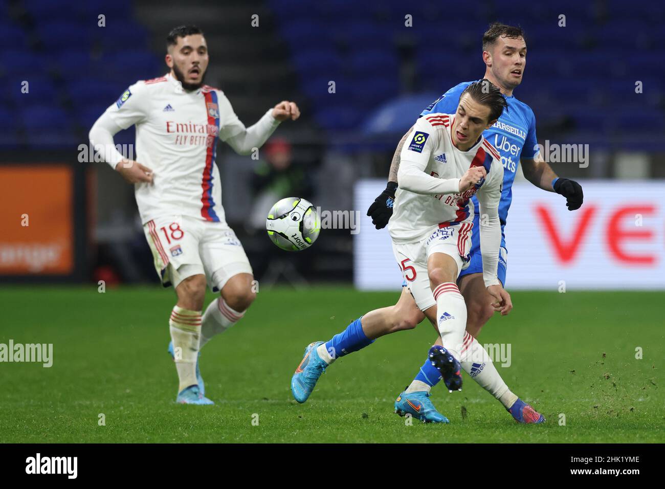 Lyon, France, 1st February 2022. Rayan Cherki of Lyon looks on as team mate Maxence Caqueret of Lyon dispossesses Pol Lirola of Olympique De Marseille during the Uber Eats Ligue 1 match at the Groupama Stadium, Lyon. Picture credit should read: Jonathan Moscrop / Sportimage Stock Photo