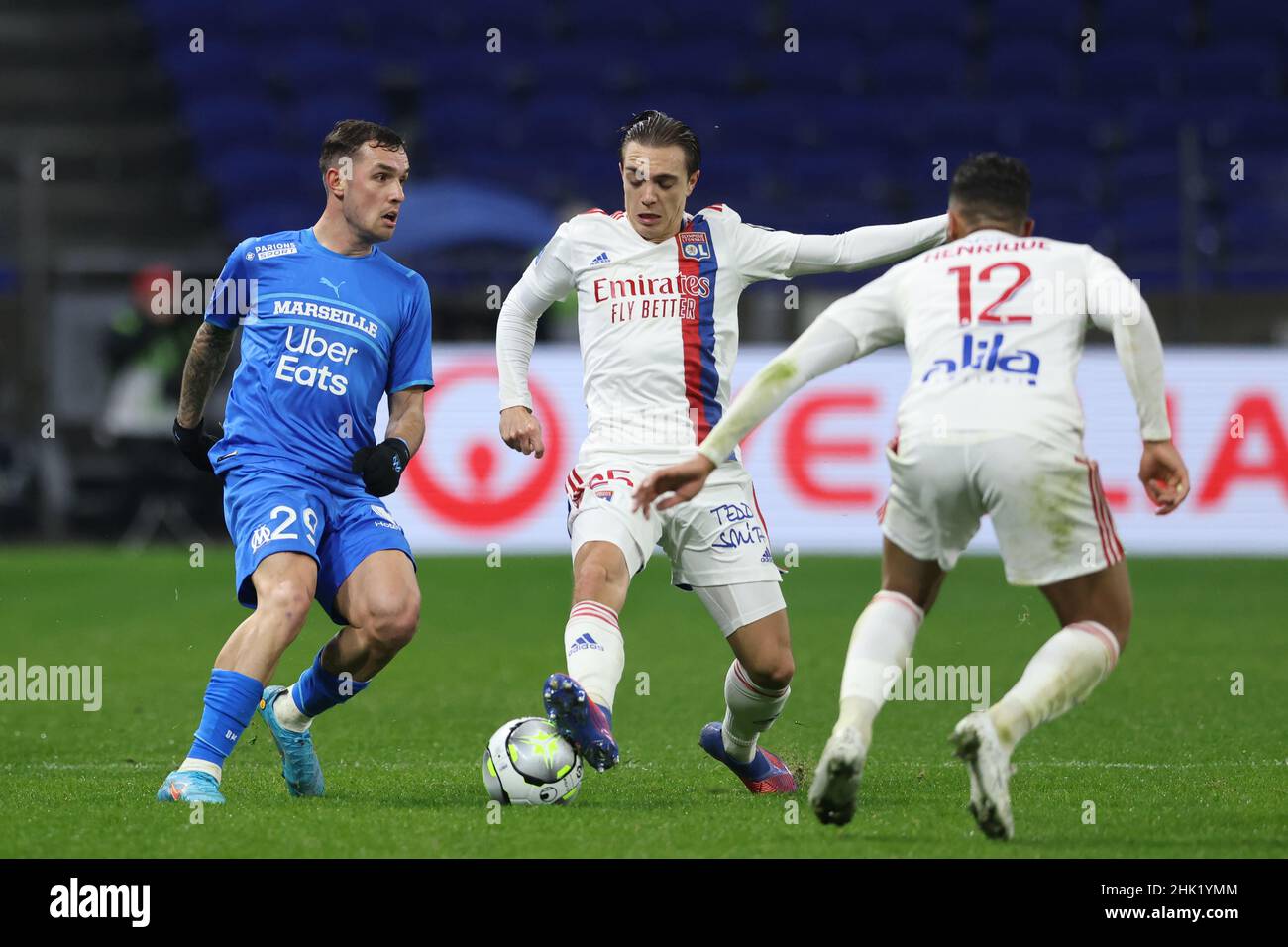 Lyon, France. 1st Feb, 2022. Henrique of Lyon looks on as team mate Maxence Caqueret blocks a pass by Pol Lirola of Olympique De Marseille during the Uber Eats Ligue 1 match at the Groupama Stadium, Lyon. Picture credit should read: Jonathan Moscrop/Sportimage Credit: Sportimage/Alamy Live News Stock Photo