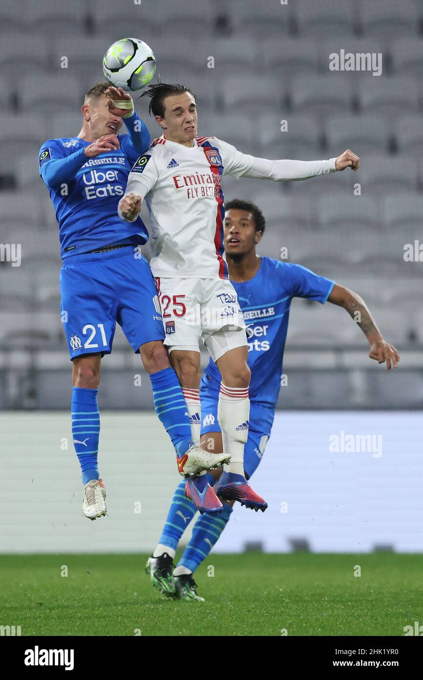 Lyon, France. 1st Feb, 2022. Boubacar Kamara of Olympique De Marseille looks on as team mate Valentin Rongier contests Maxence Caqueret of Lyon for an aerial ball during the Uber Eats Ligue 1 match at the Groupama Stadium, Lyon. Picture credit should read: Jonathan Moscrop/Sportimage Credit: Sportimage/Alamy Live News Stock Photo