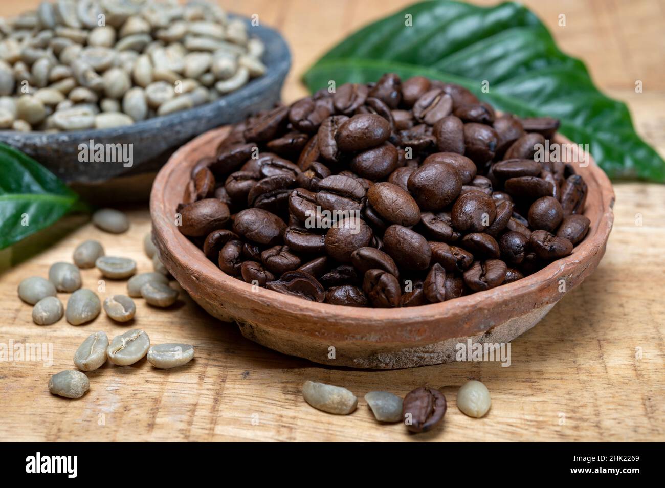 Green unroasted and brown roasted coffee beans from Africa coffee